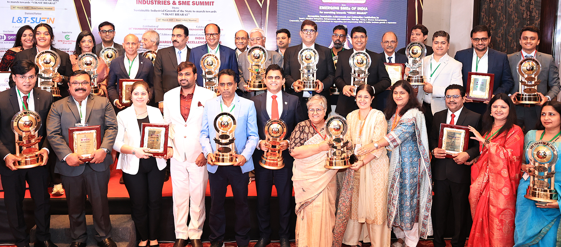 Business leaders receiving an excellence award on stage